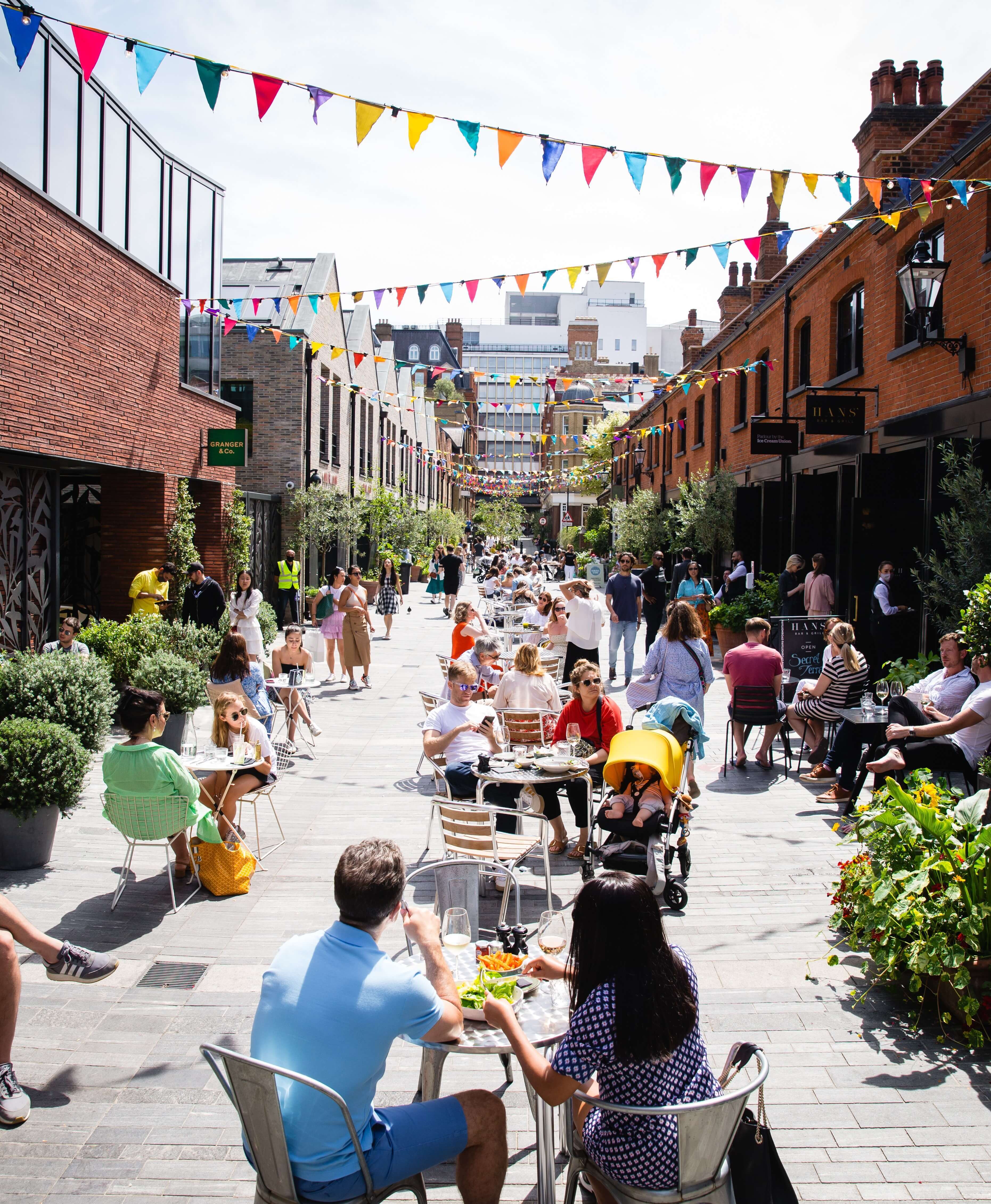 Day time view of people dining outdoors in Pavilion Road