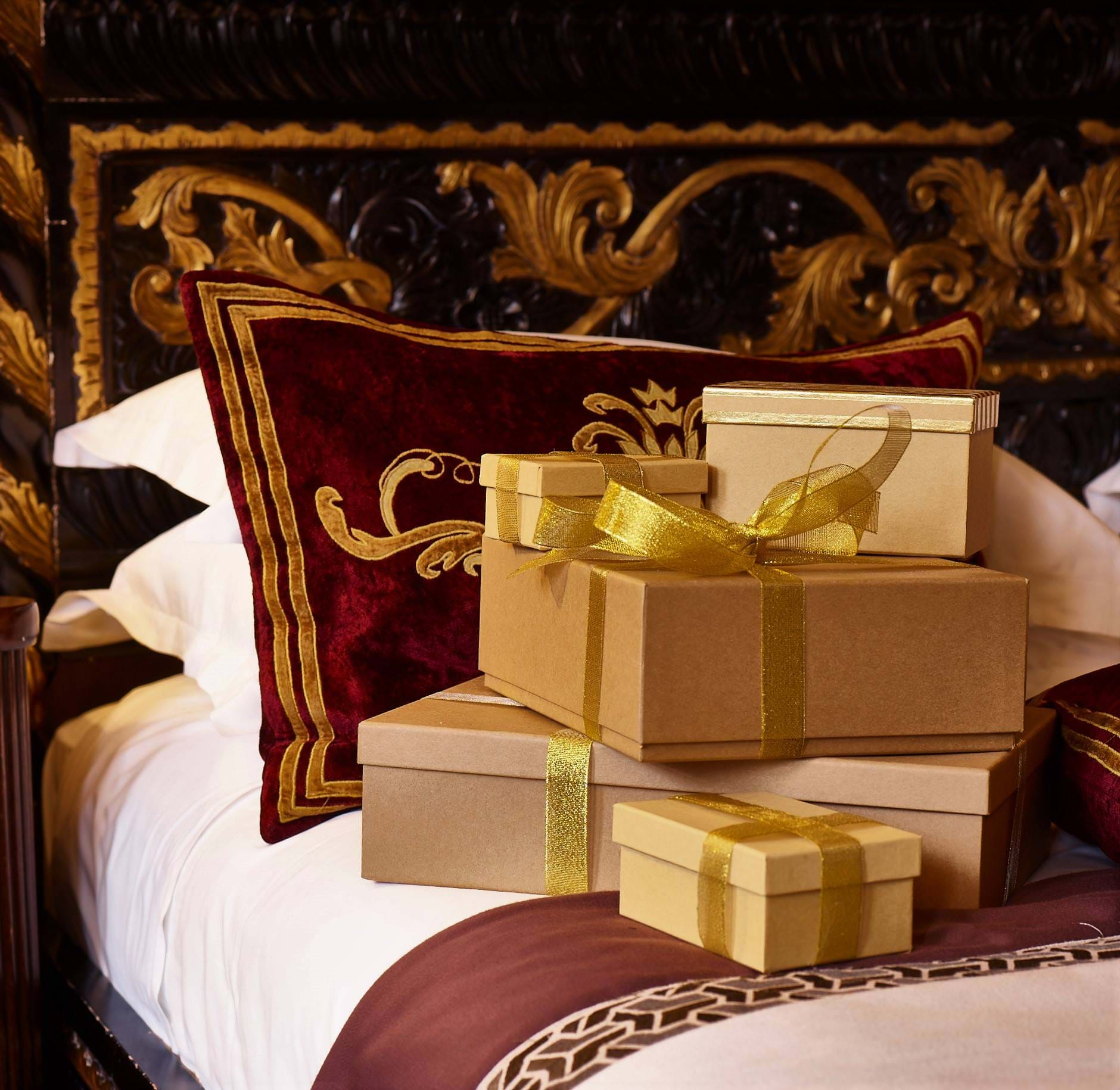 Christmas presents on top of bed at 11 Cadogan Gardens